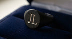 The Heritage custom black signet ring with engraved monogram initials
