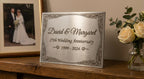 The Milestone stainless steel anniversary plaque with engraved names and date
